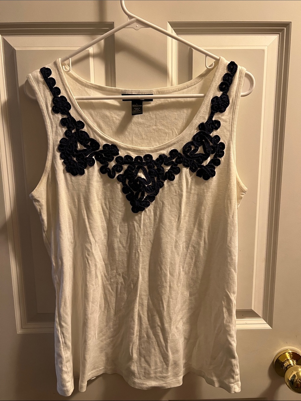 White tank top with blue embroidery